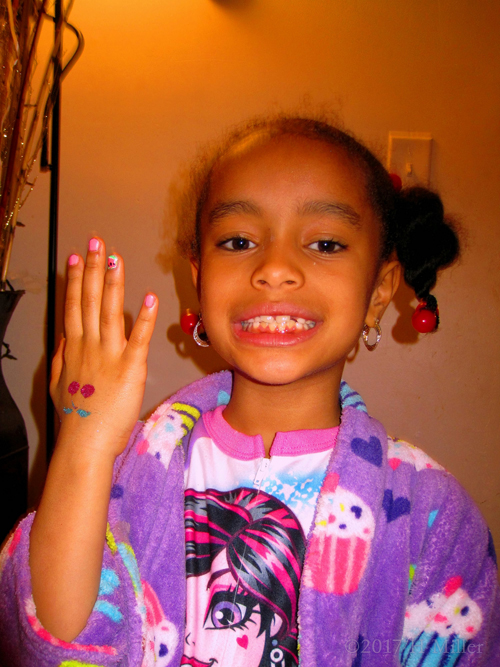 Flaunting Her Pretty Mini Mani With Shining Glitter Temporary Tattoo. Flaunting Her Pretty Mini Mani With Shining Glitter Temporary Tattoo.