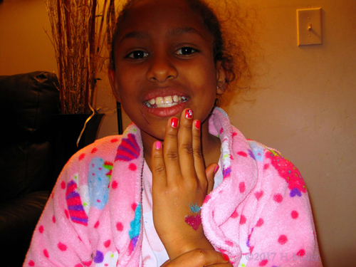 Smiling After Her Pretty Girls Mani And Glittery Temporary Tattoo.