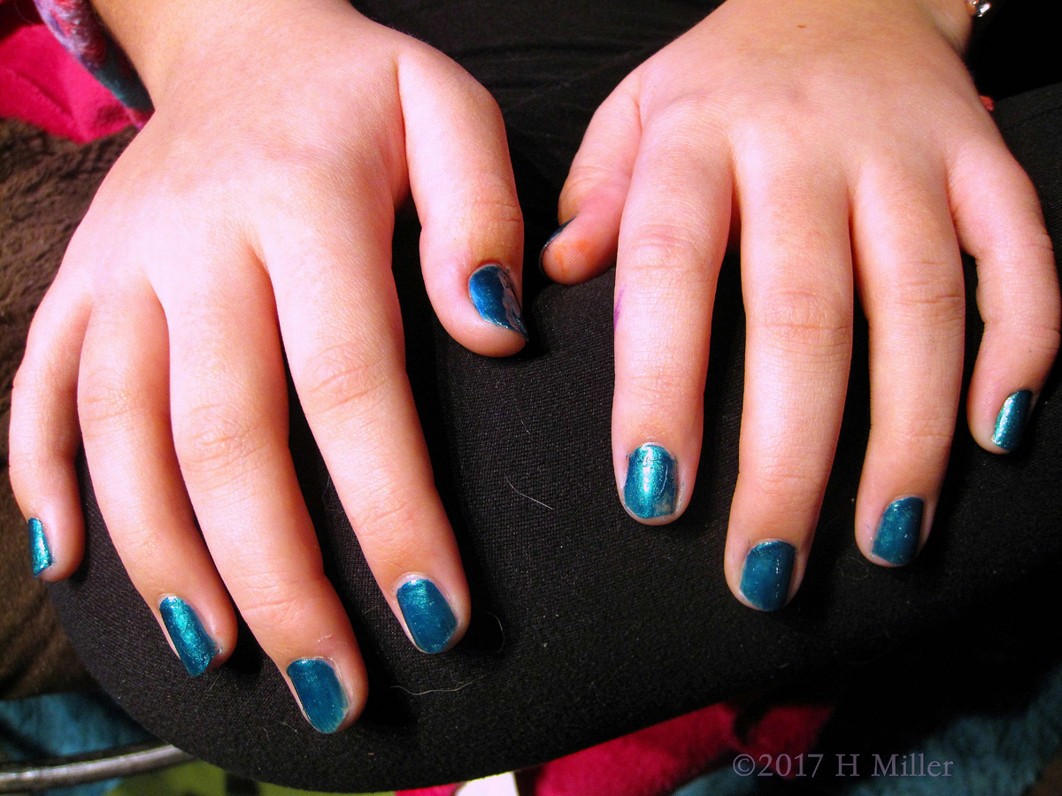 Shiny Metallic Blues For This Girls Manicure. 
