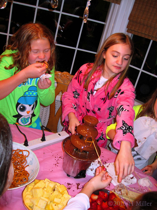 The Spa Party Guests Are Busy With The Delicious Chocolate Fondue Dessert! The Spa Party Guests Are Busy With The Delicious Chocolate Fondue Dessert!