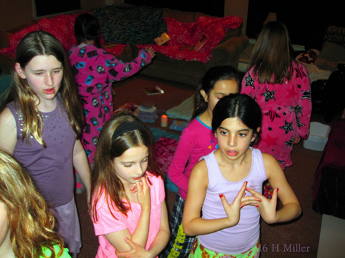 While Selecting Their Spa Robes, The Girls Are Pensive. While Selecting Their Spa Robes, The Girls Are Pensive.