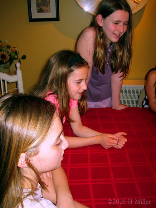 Spa Party Guests Gathered Around The Birthday Cake Table!