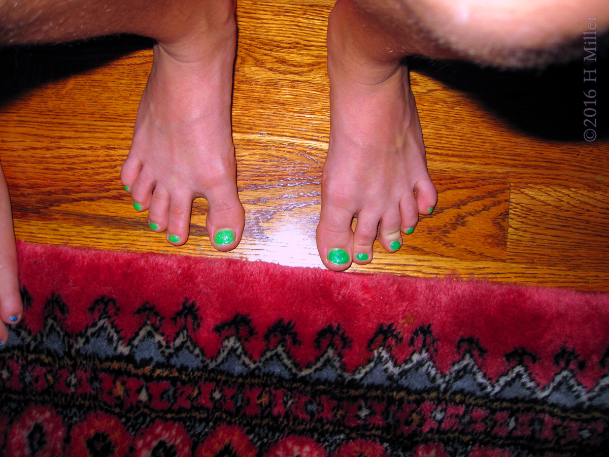 Her Kids Pedicure Is Such A Lovely Green Shade! 