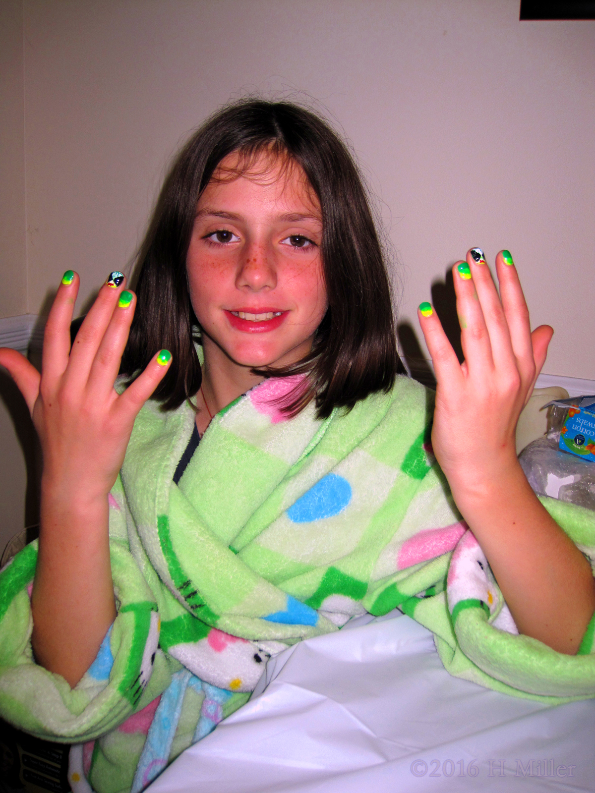Showing Her Cool Nail Designs On Her Manicure. 