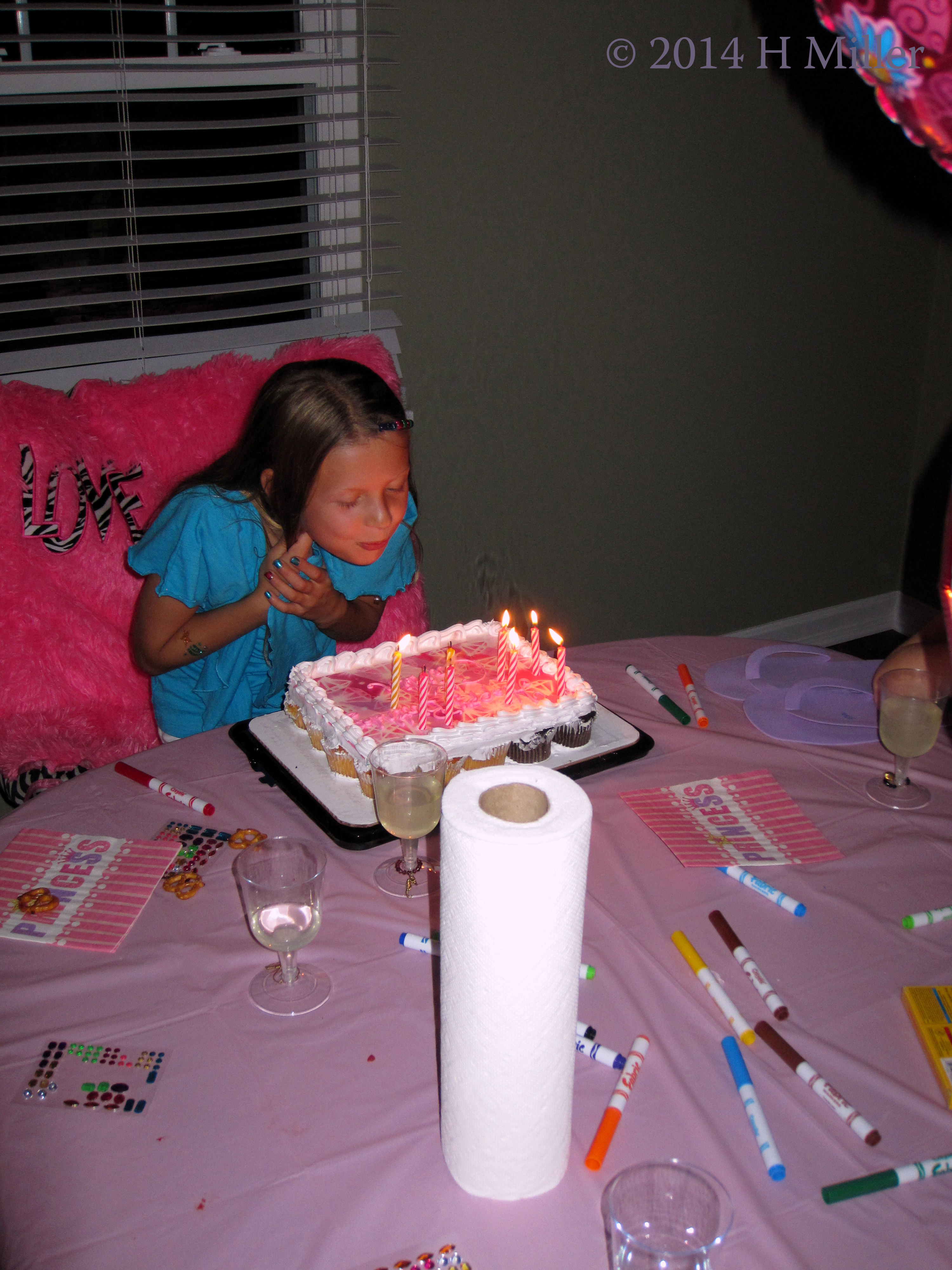 Caitlin Blowing Out The Candles At Her Spa Birthday Party. Caitlin Blowing Out The Candles At Her Spa Birthday Party.