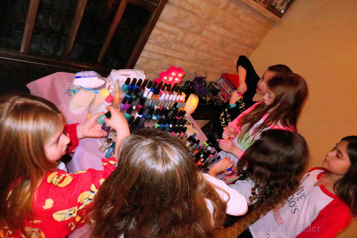 The Girls Check Out The Nail Polish Bottles. 