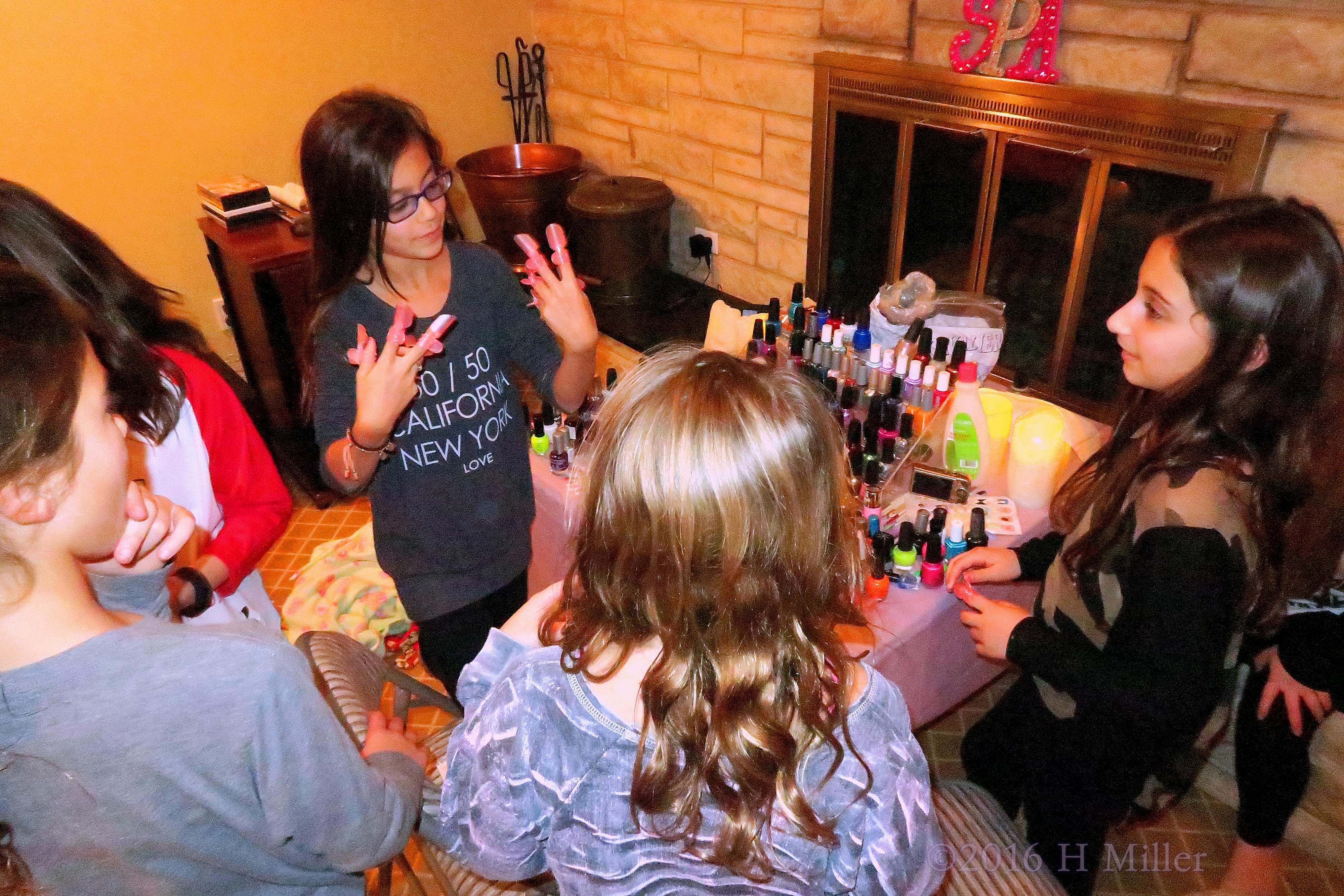 Showing Her Nail Protectors To Her Campmates. Showing Her Nail Protectors To Her Campmates.