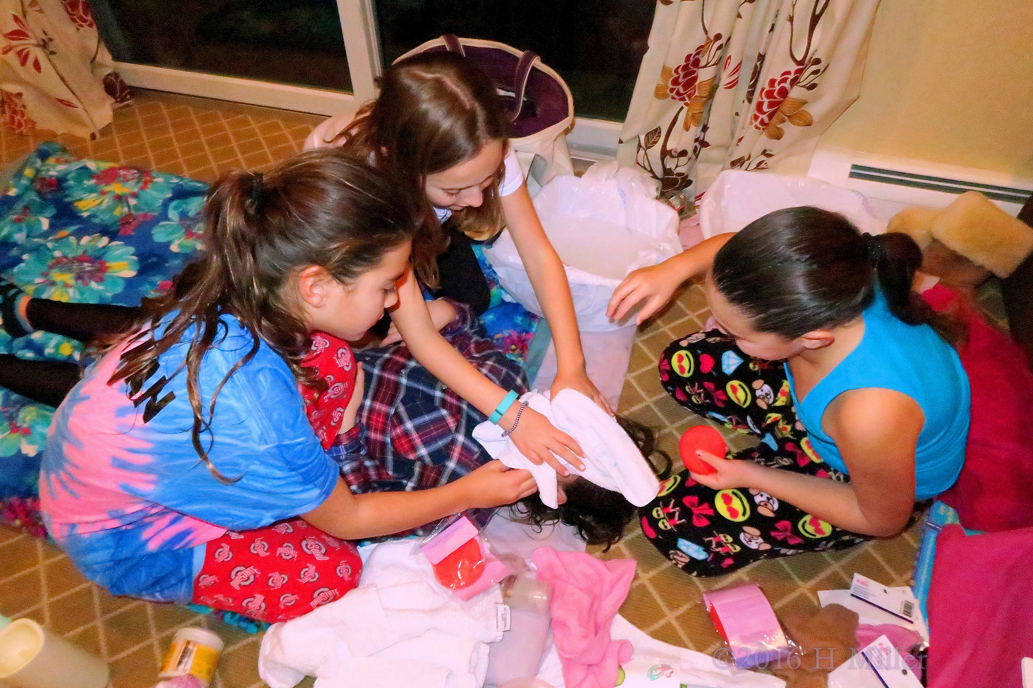 Girls Removing The Facial Mask For Their Friend. 