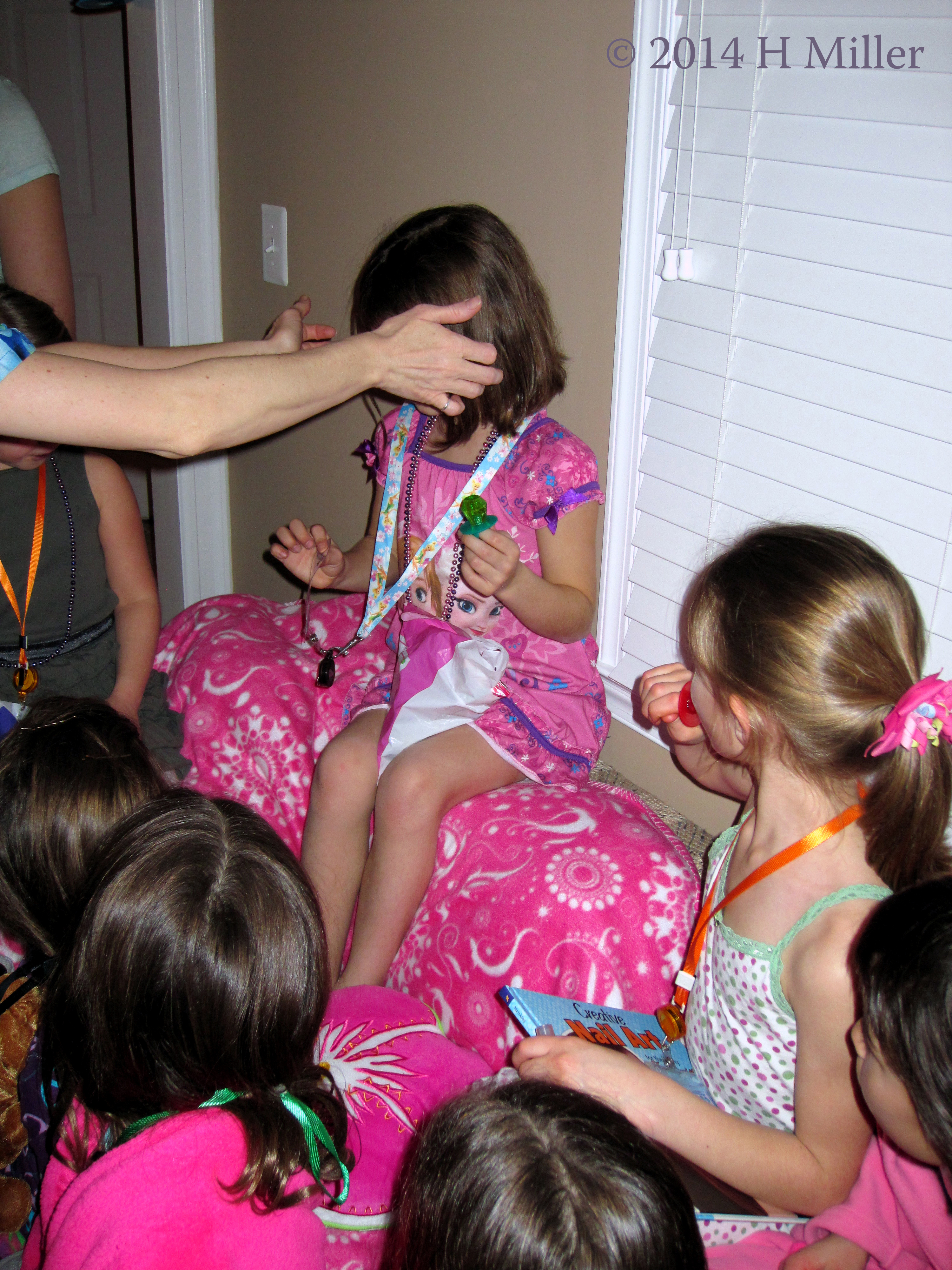 Placing The Lanyard On The Birthday Girl. Placing The Lanyard On The Birthday Girl.