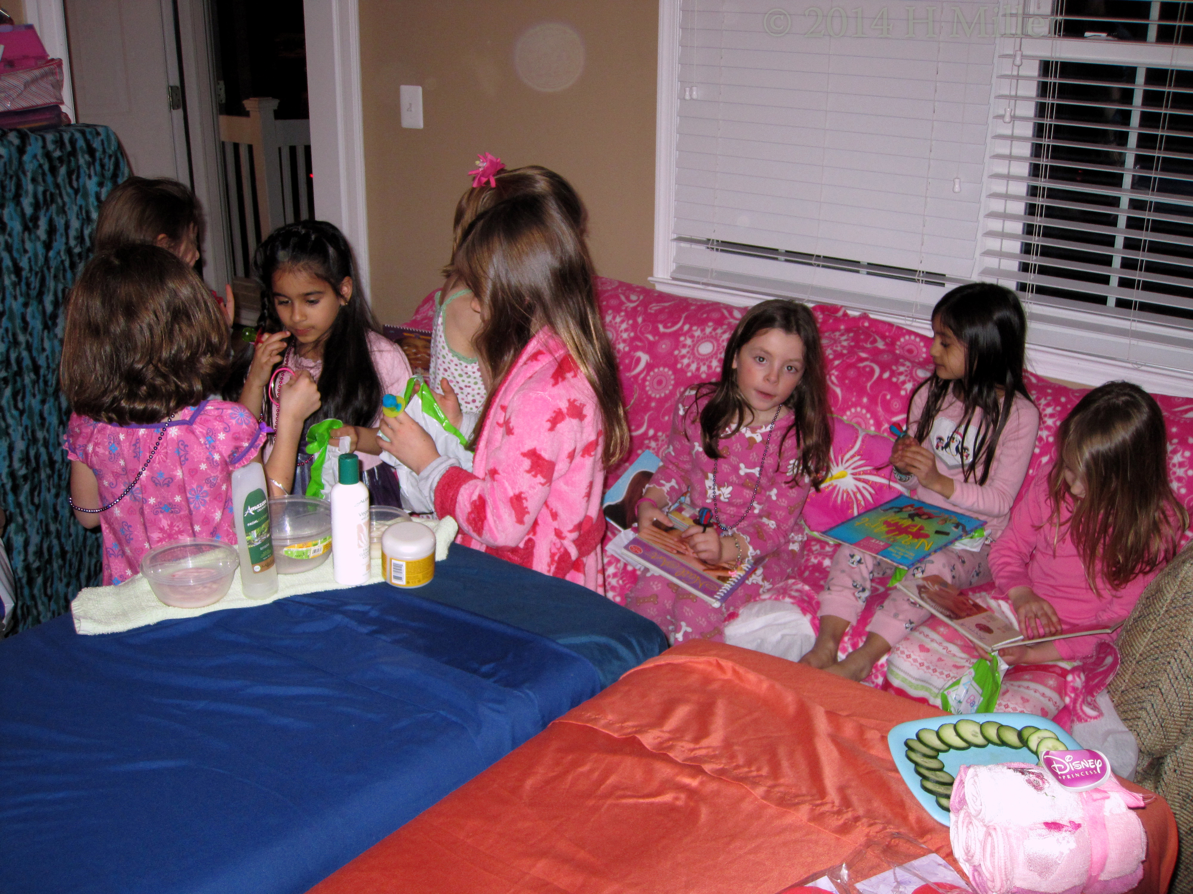The Girls Perusing The Nail Art Books, Looking For Designs Each Likes. The Girls Perusing The Nail Art Books, Looking For Designs Each Likes.