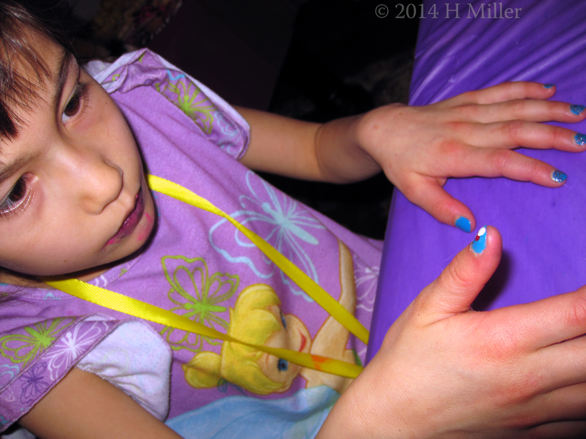 Intently Watching Her Nail Art Being Done. Intently Watching Her Nail Art Being Done.