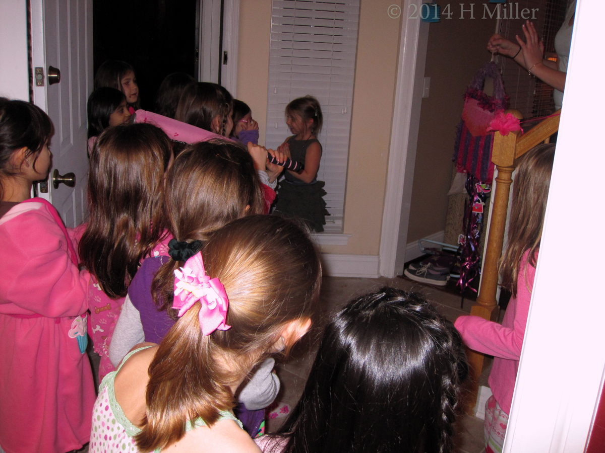 Another Spa Birthday Party Guest Takes A Swing At The Pinata. Another Spa Birthday Party Guest Takes A Swing At The Pinata.