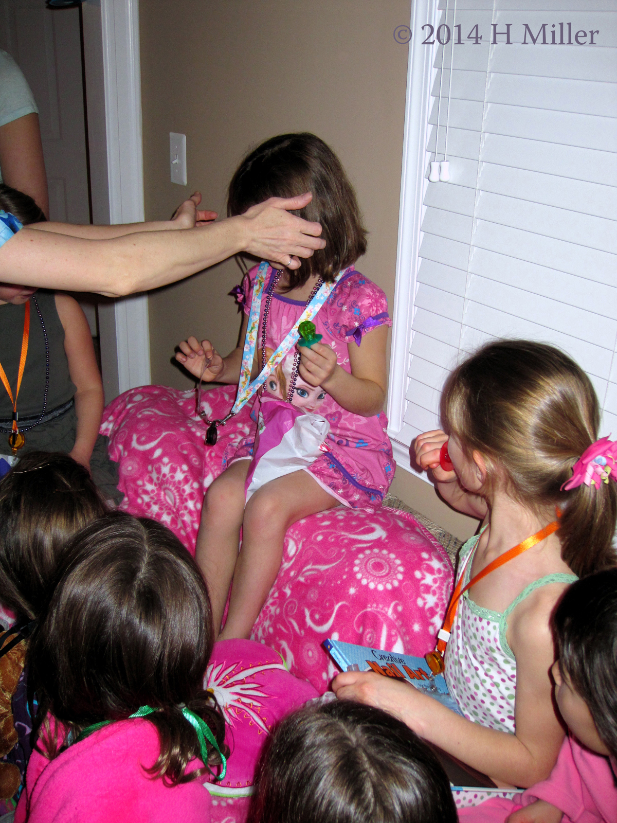 Placing The Lanyard On The Birthday Girl. Placing The Lanyard On The Birthday Girl.