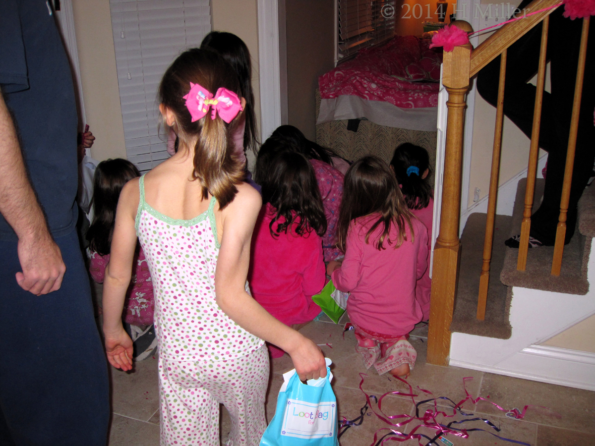 The Girls Gather Up The Candies From The Pinata. 