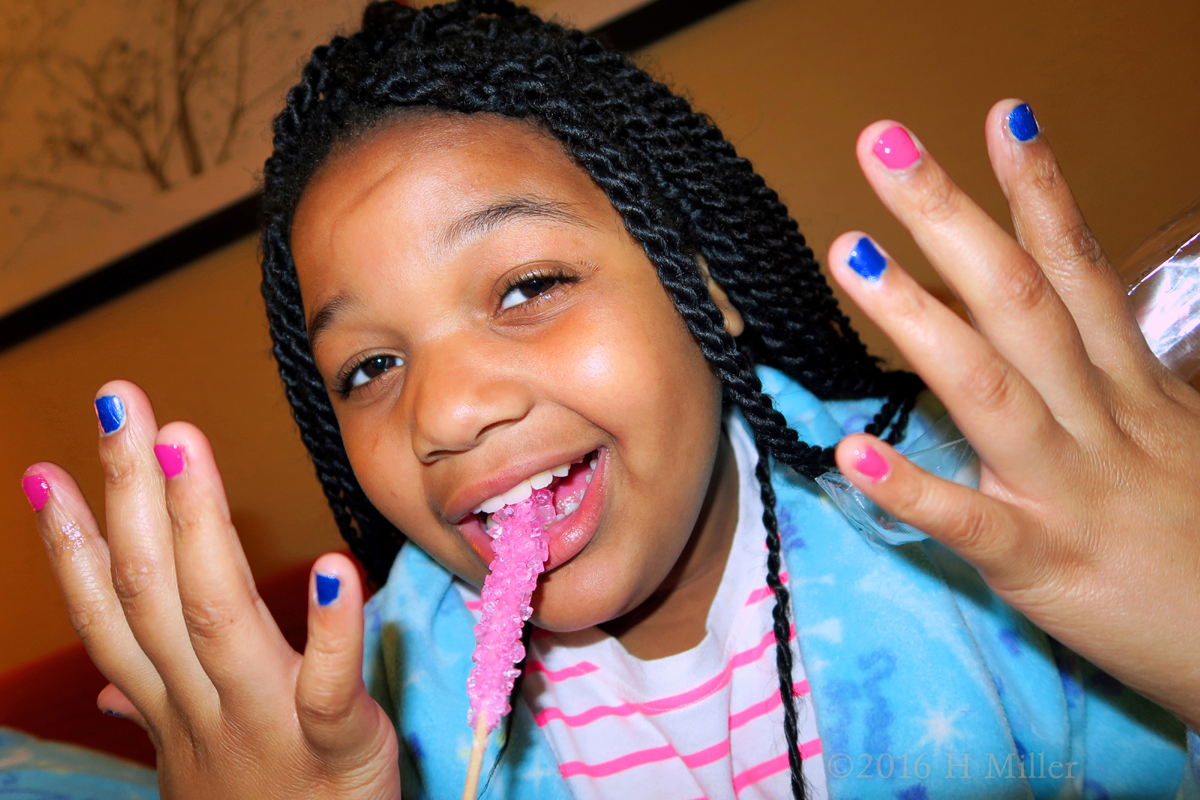 Showing Her Cool New Mani. (While Eating Rock Candy!) 