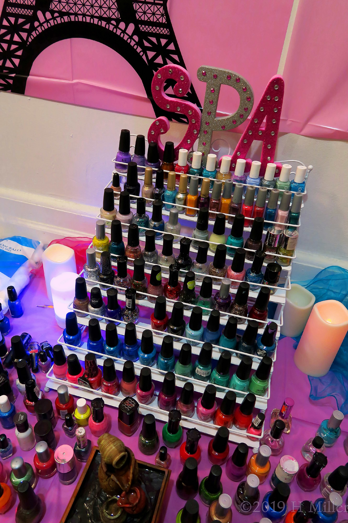 Small Fountain With All Nail Polishes At The Nail Station 