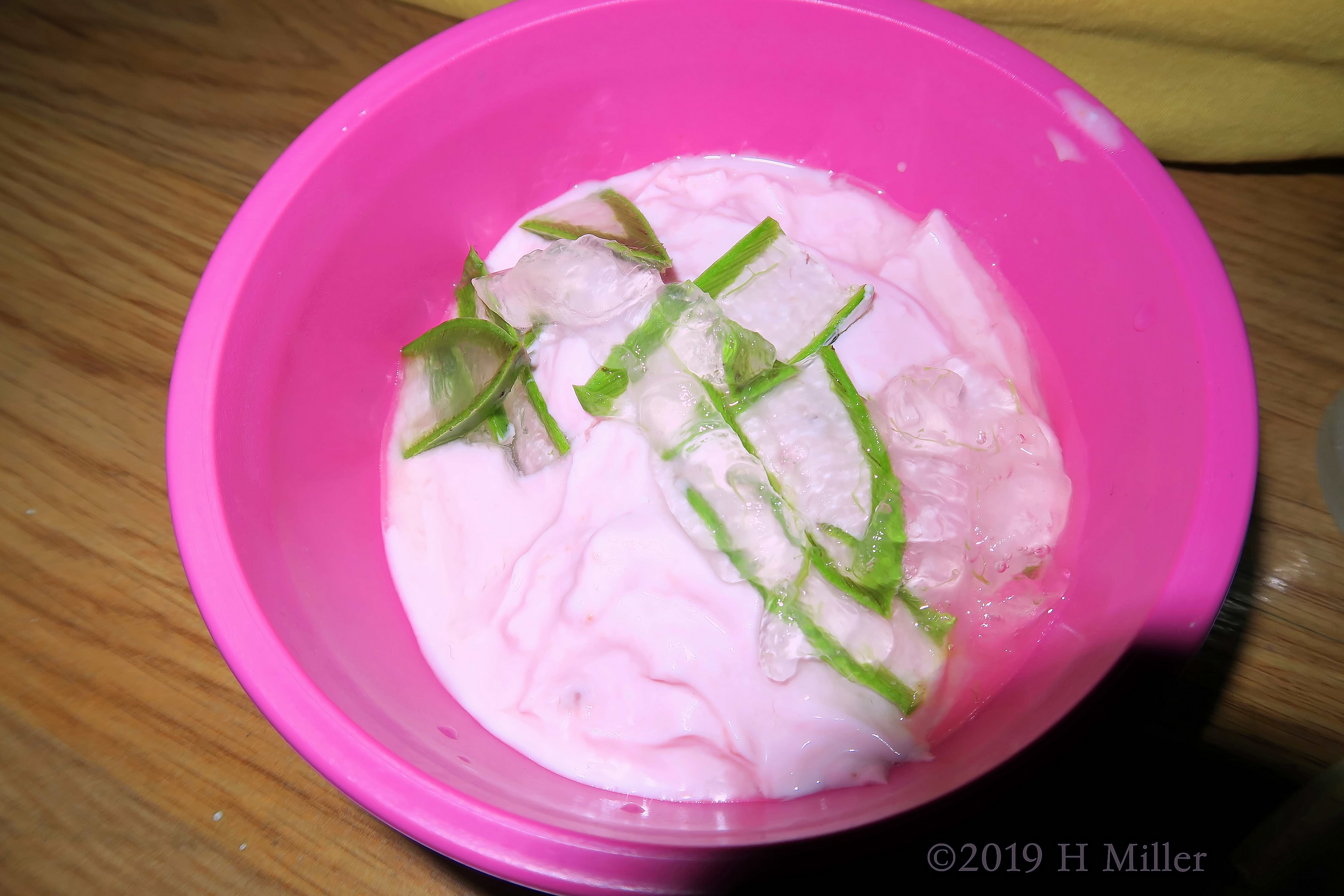 Facial Masque With Aloe Pieces And Strawberry In A Pink Bowl 