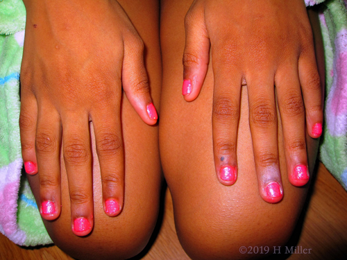 Pink Manicure For Girls With Sparkles And A Pink Bas