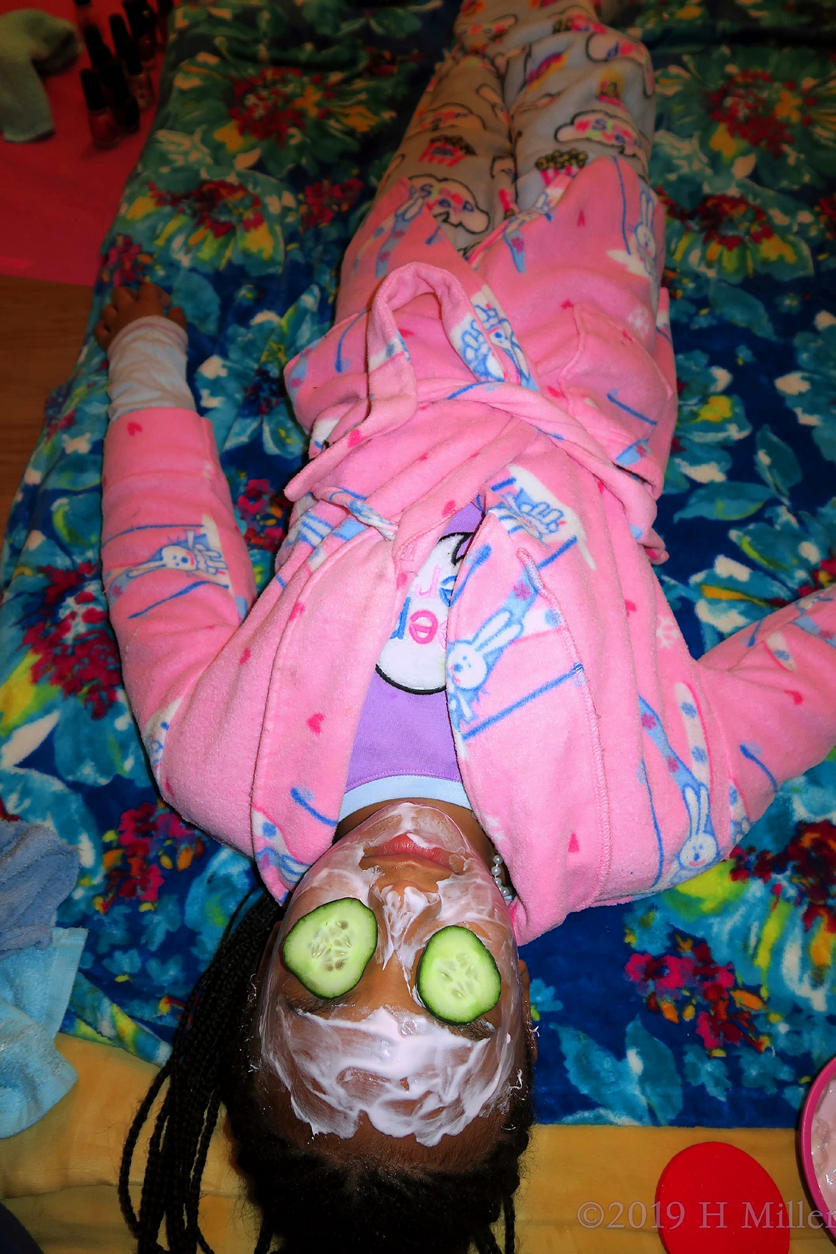 Cupcake Robed Guest On Blue Spa Mat With Cukes On Her Eyes, During Her Facial For Girls. 