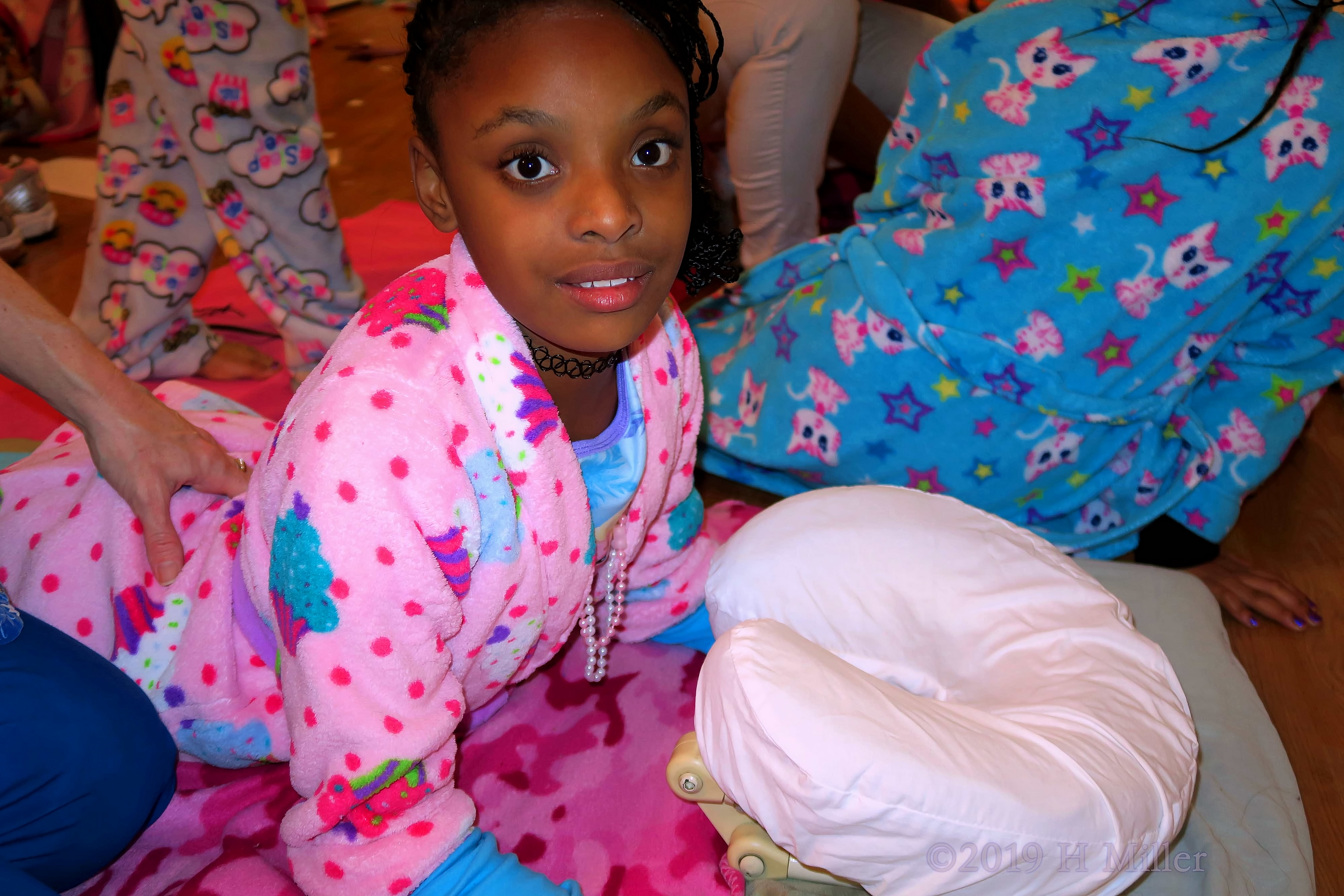 Bunny Spa Robe Guest On Blue Flowered Spa Mat, During Her Kids Massage Bunny Spa Robe Guest On Blue Flowered Spa Mat, During Her Kids Massage