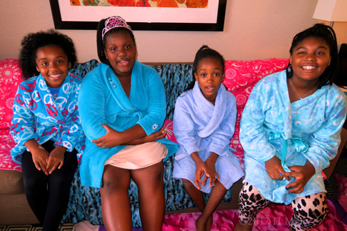 Birthday Girl And Friends Pose On The Comfy Spa Couch.