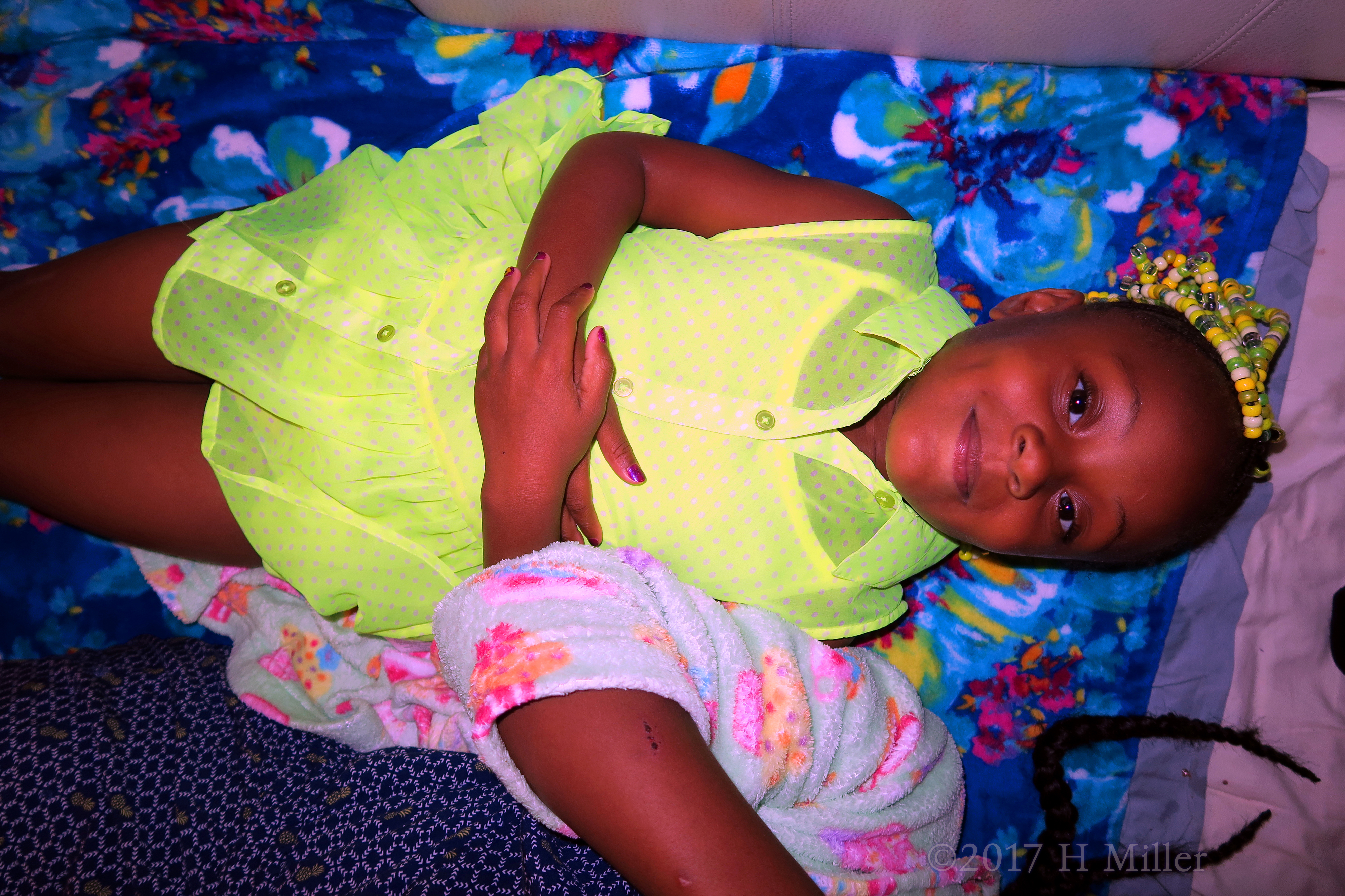 Happily Lying In The Kids Facial And Massage Area, Waiting For Her Turn! Happily Lying In The Kids Facial And Massage Area, Waiting For Her Turn!