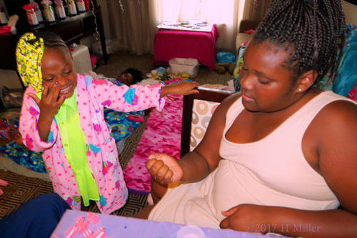 Looking At Her Nails During The Kids Manicure Session.