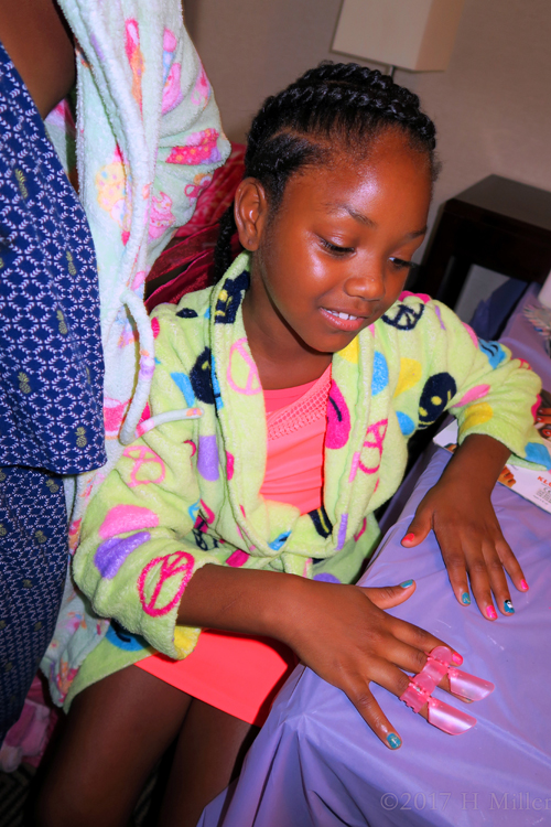 She's Almost Done With Her Pretty Cool Mani She's Almost Done With Her Pretty Cool Mani