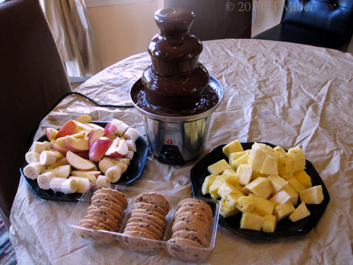 Chocolate Fountain, Fruits, And Cookies