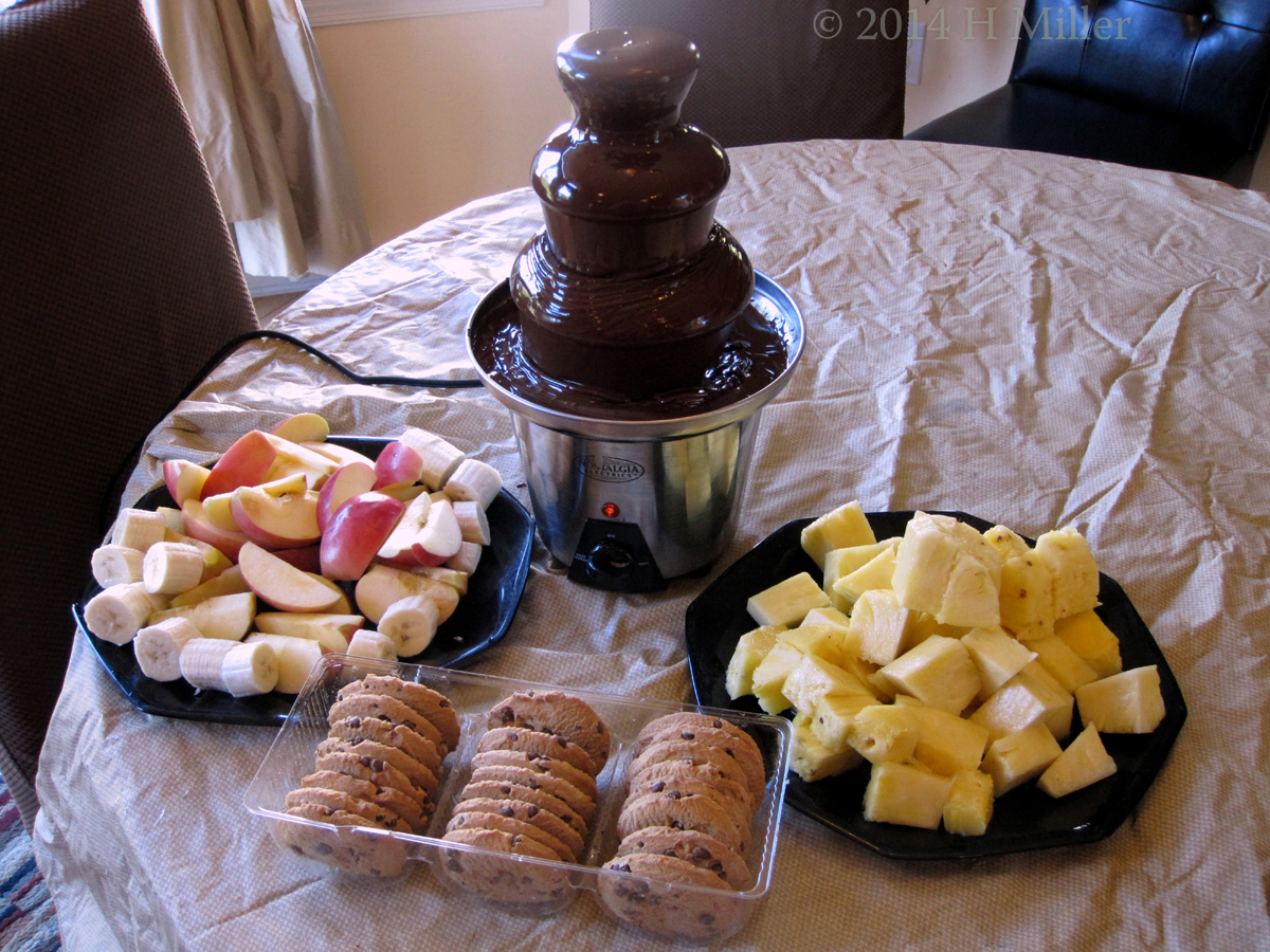 Chocolate Fountain, Fruits, And Cookies.
