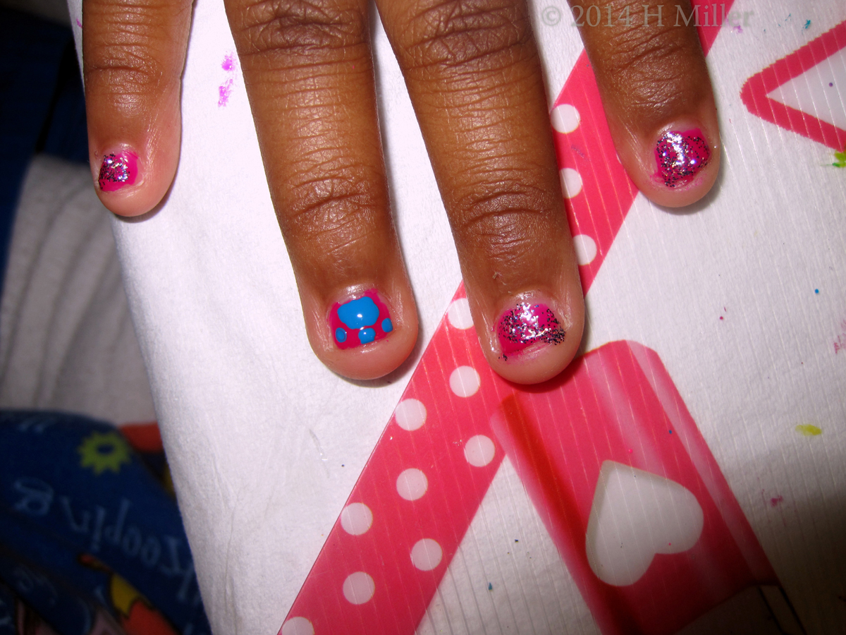 Pink With Silver Giller And Blue Paw Nail Art 