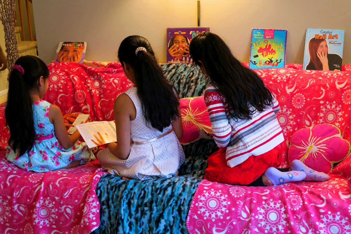 The Girls Sitting On The Couch Exploring Kids Spa Nail Art Books! 