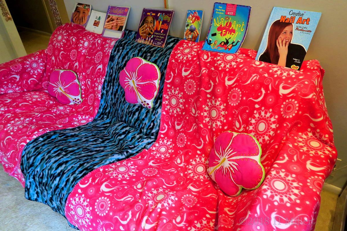 The Spa Couch Covered With Spa Throws With Nail Art Books On Top! 