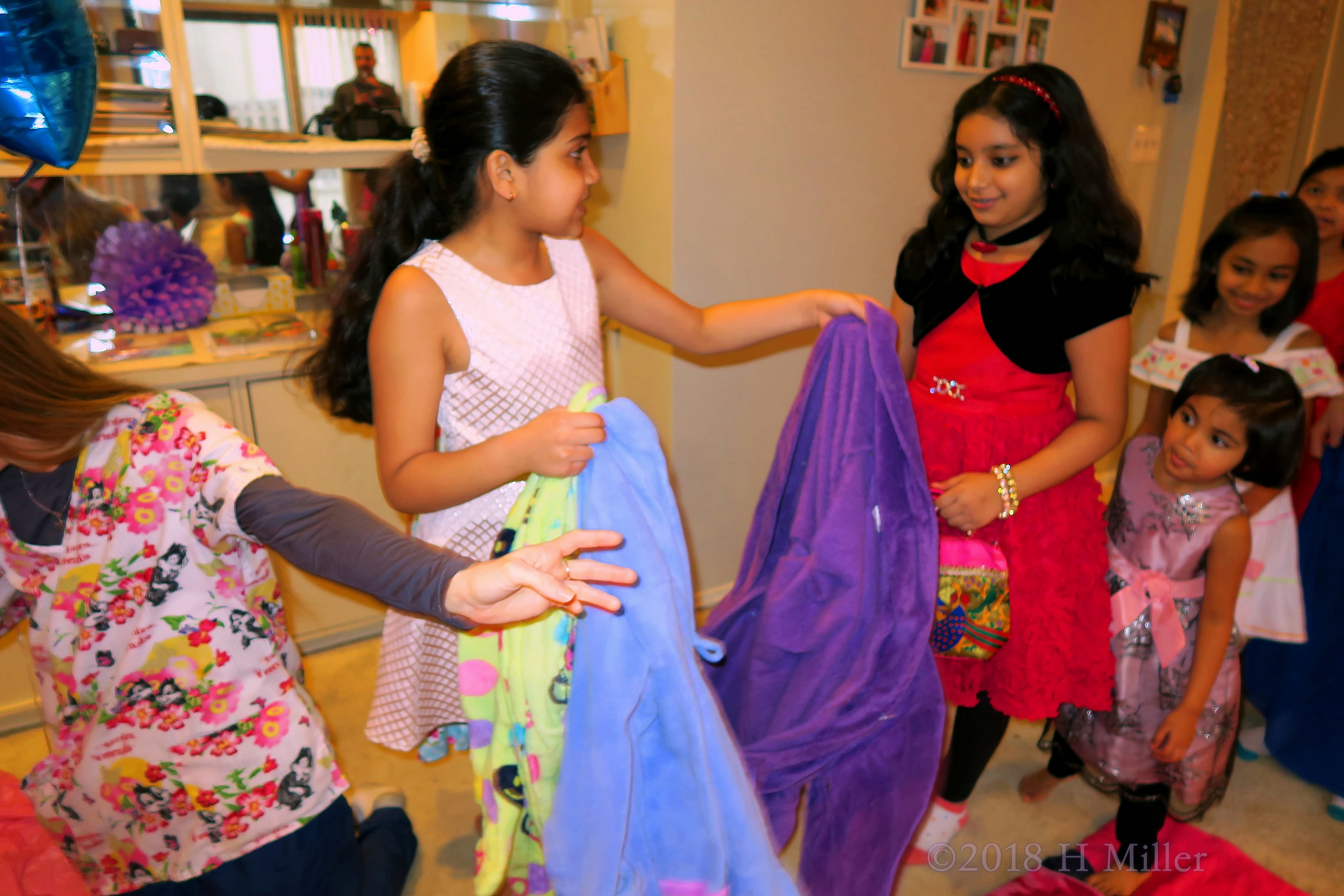 Distributing Colorful Spa Robes To The Girls. 