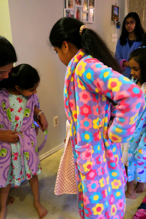 Seeking Help To Put Their Spa Robe On. Seeking Help To Put Their Spa Robe On.