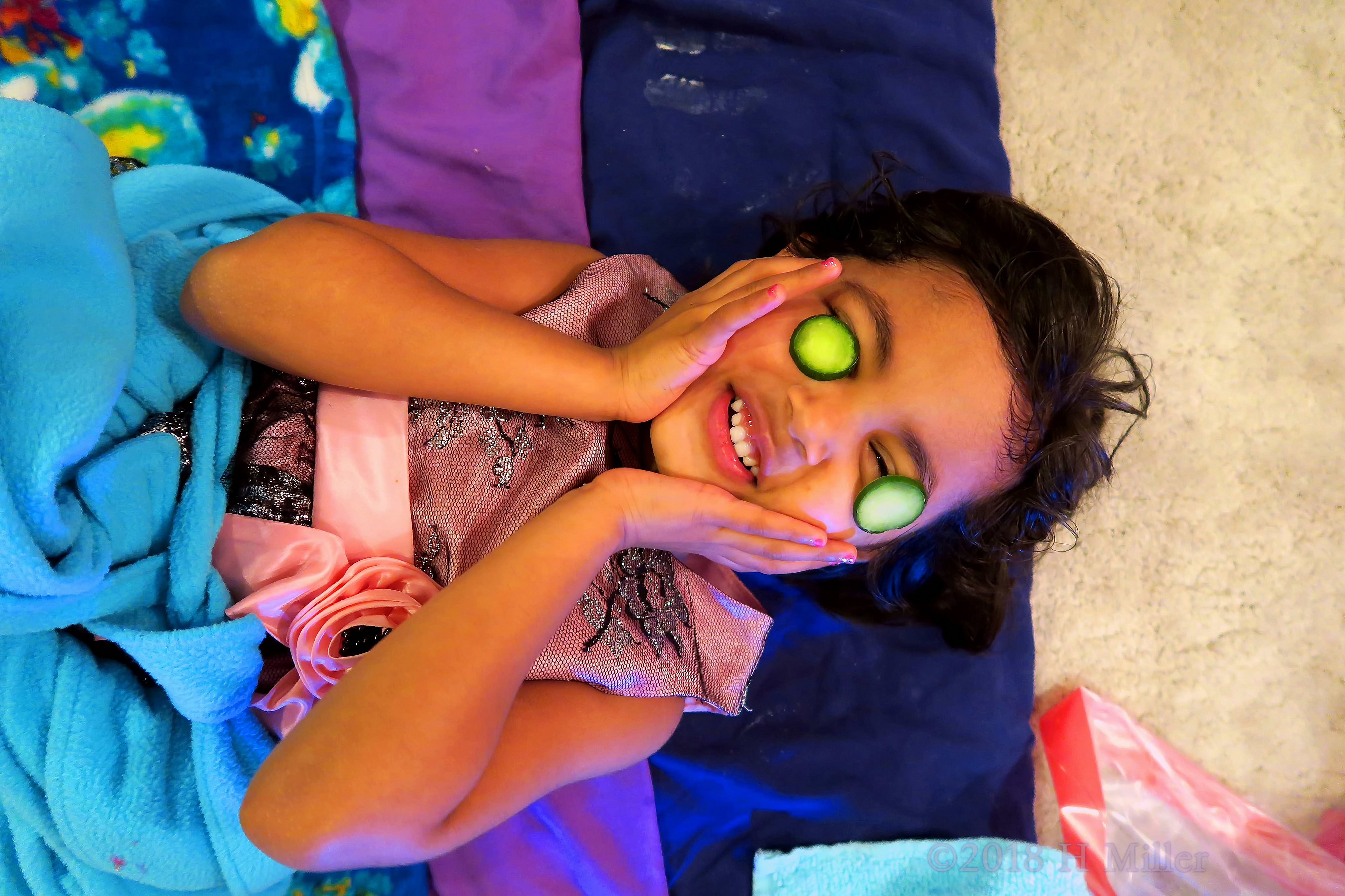 Enjoying The Cool Sensation Of Cukes Over Her Eyes! 