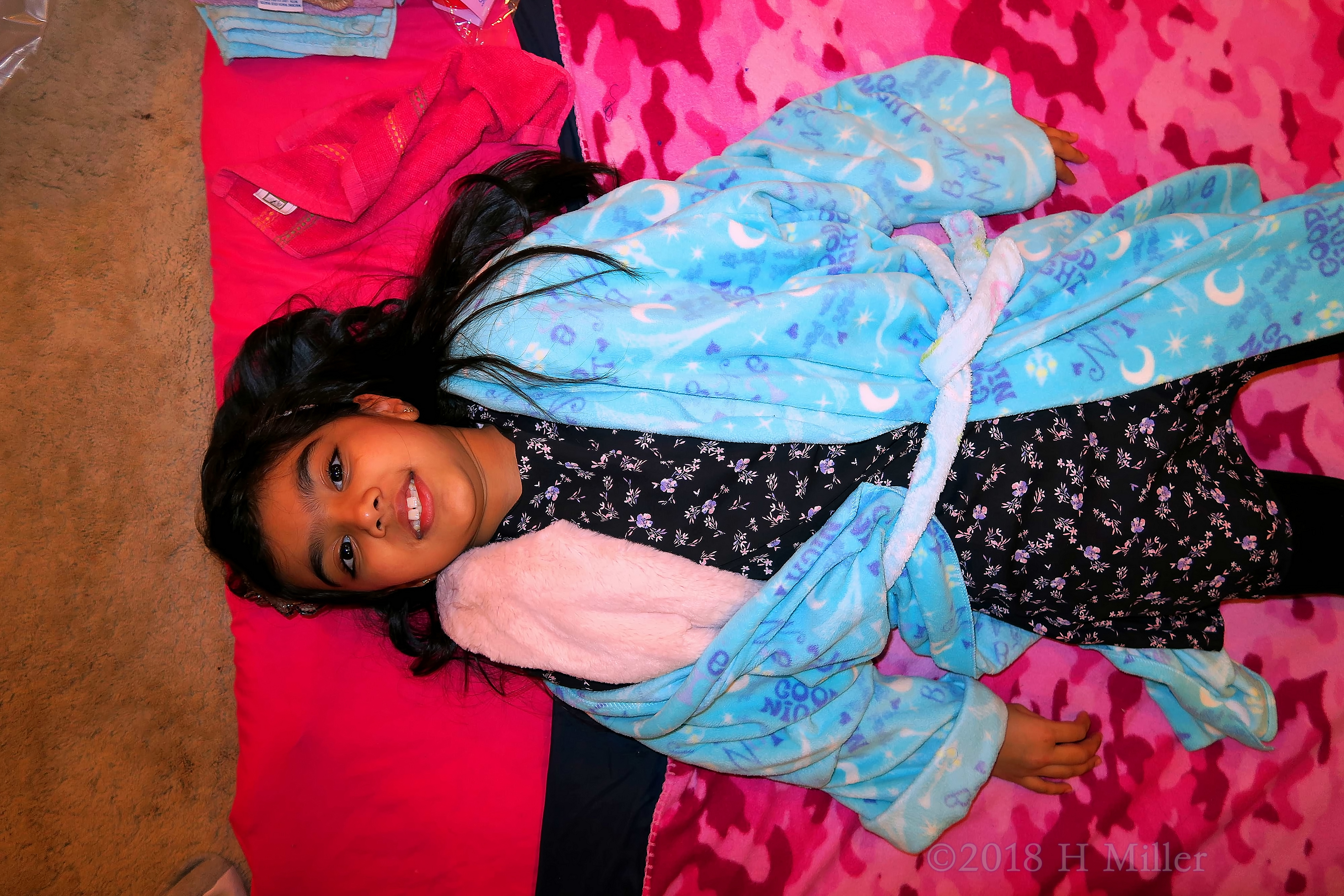 Lying On The Girls Facial Mat, Ready For The Activity To Begin. Lying On The Girls Facial Mat, Ready For The Activity To Begin.