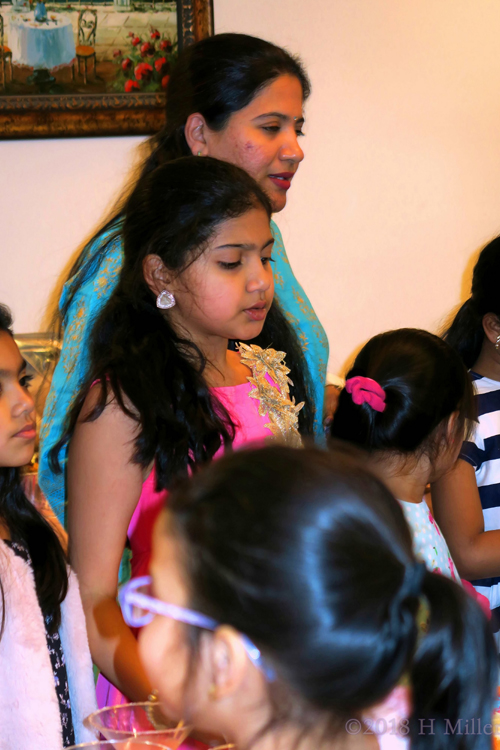 A Photo During The Cake Cutting At The Birthday Celebration. A Photo During The Cake Cutting At The Birthday Celebration.