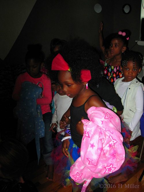 Putting On Their Kids Spa Robes Putting On Their Kids Spa Robes