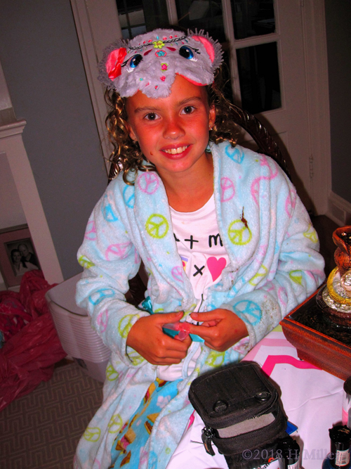 Birthday Girl Putting On Nail Protectors For Her Mini Mani. Birthday Girl Putting On Nail Protectors For Her Mini Mani.