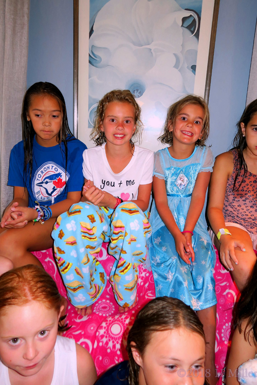 Birthday Girl Sitting With Her Friends Before The Party Begins. Birthday Girl Sitting With Her Friends Before The Party Begins.