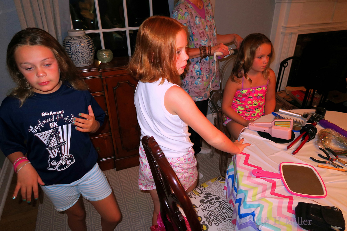 Hairstyling For Girls Going On While The Others Wait For Their Turn. 