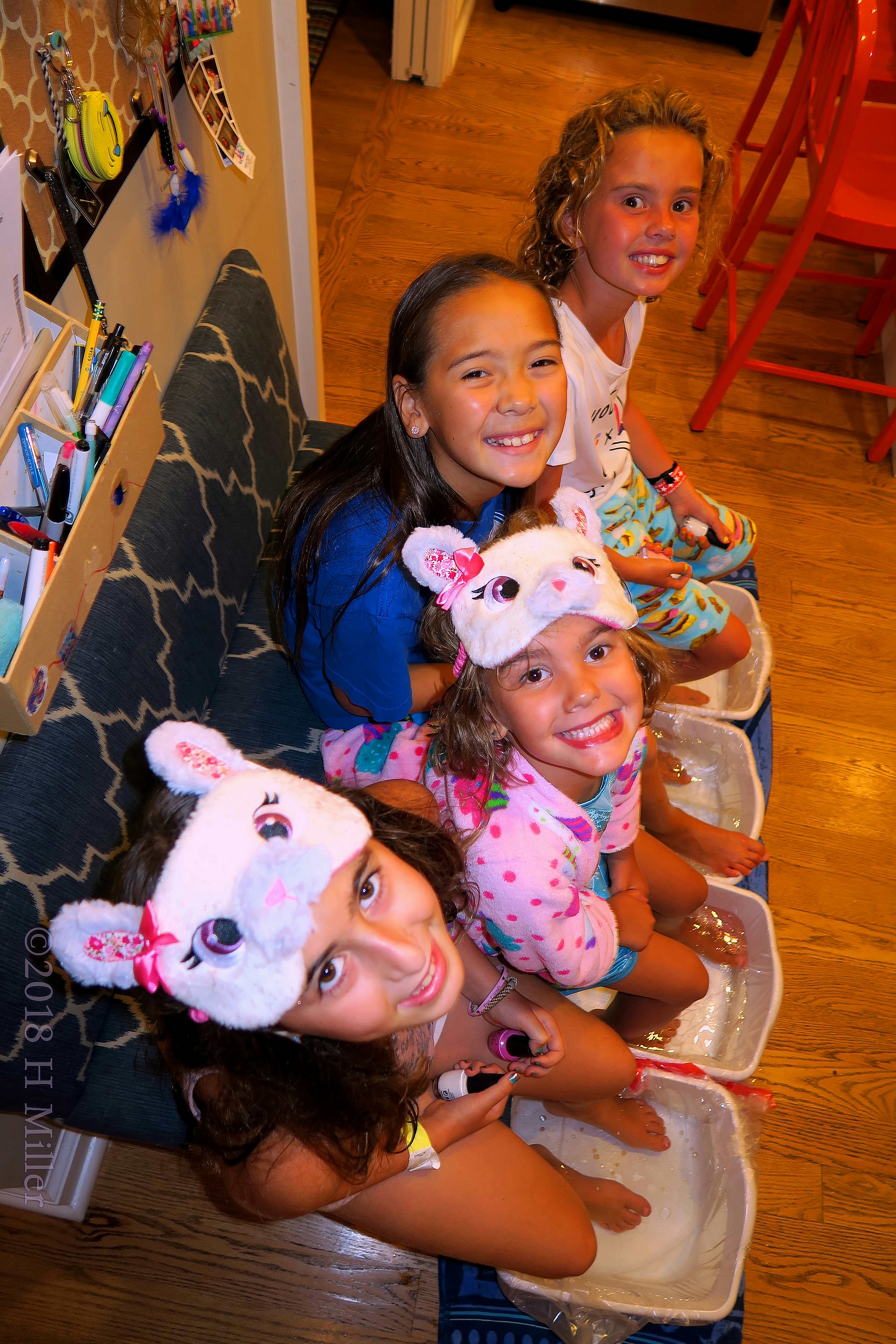 Little Girls Relax In Kids Pedicure Footbaths. Little Girls Relax In Kids Pedicure Footbaths.