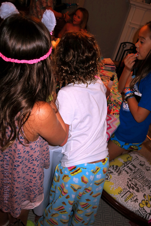 Girls Are Gathered Around The Manicure Table. Girls Are Gathered Around The Manicure Table.