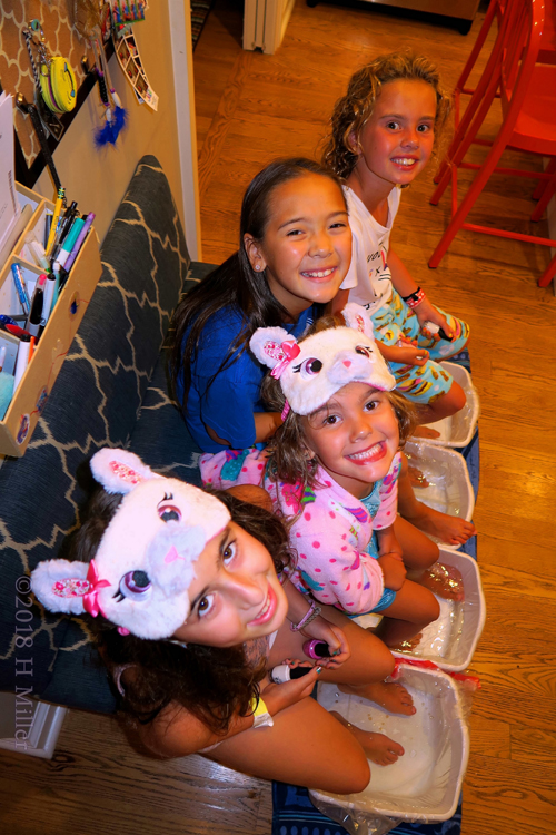 Little Girls Relax In Kids Pedicure Footbaths. Little Girls Relax In Kids Pedicure Footbaths.