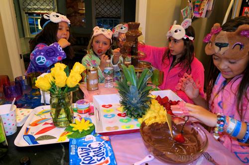 The Girls Feasting On Chocolate Fondue With Delicious Dips Of Pineapples Strawberries And Cookies! The Girls Feasting On Chocolate Fondue With Delicious Dips Of Pineapples Strawberries And Cookies!