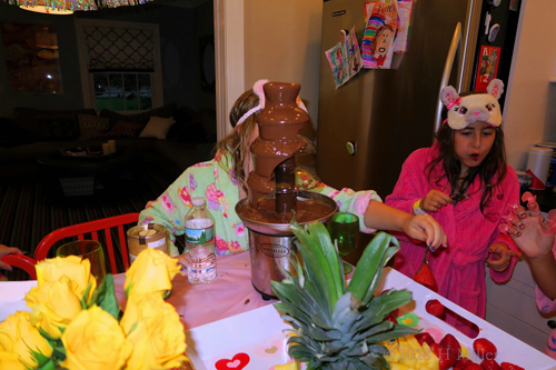 The Girls With Cool Sleeping Masks Having Fun At The Snacks Table. The Girls With Cool Sleeping Masks Having Fun At The Snacks Table.