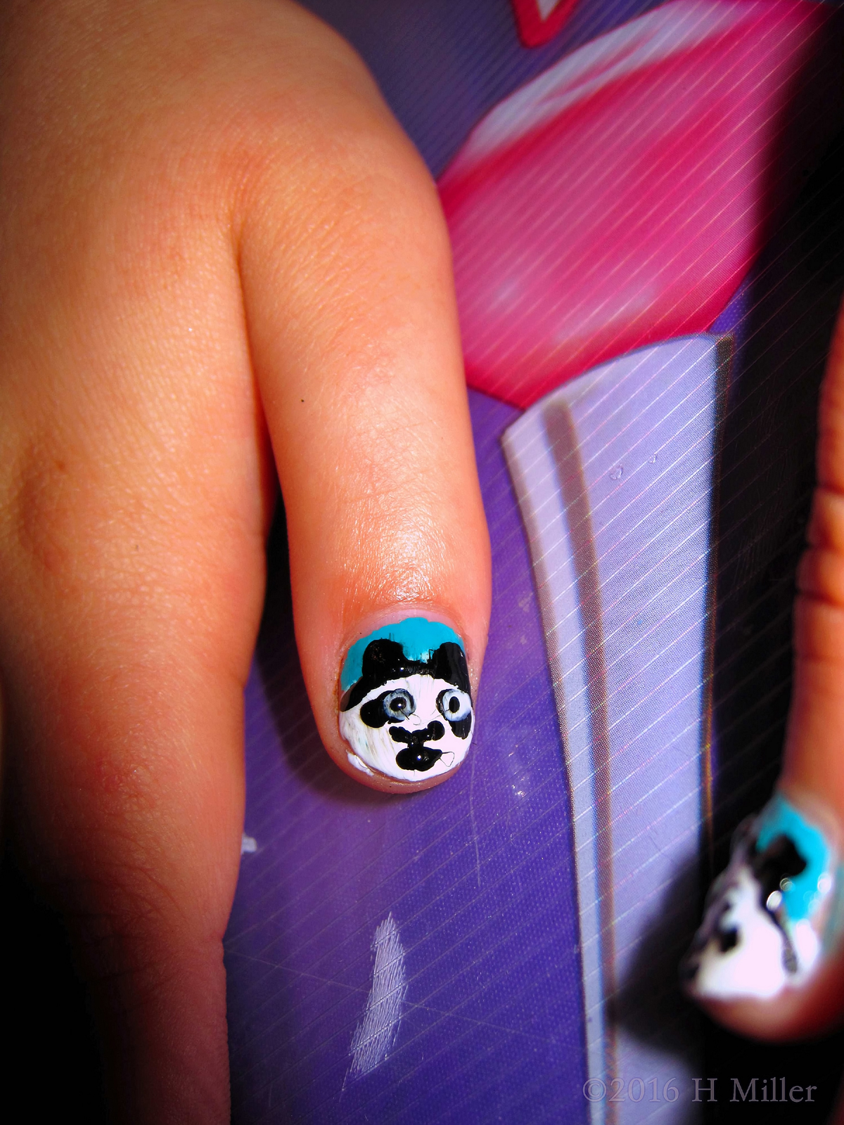 She Has Awesome Panda Kids Nail Art. 