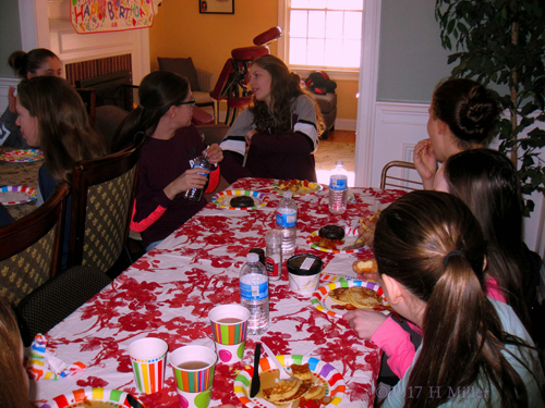 Party Guests Gathered Around The Tabl