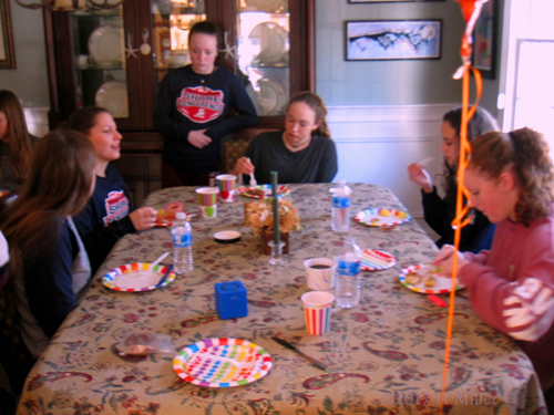 Spa Party Guests Eating On Rainbow Polka Dot Plate